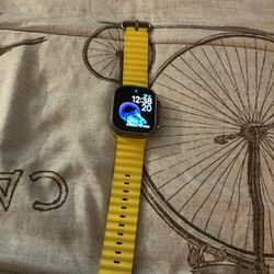 49mm Yellow Apple Watch with charging cable