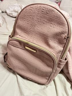 Baby pink Juicy Couture backpack with mini pouch