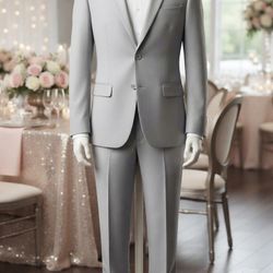 TRAJES.  