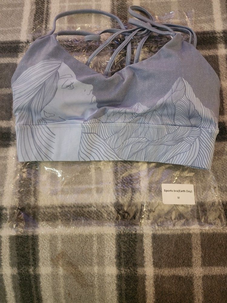Size M sports bra with Earth day pattern on front