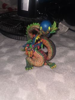 Colorful Dragon Figurine with Blue Orb