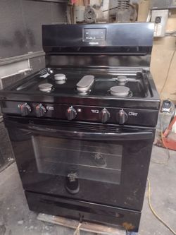 Frigidaire black stove  great condition, with black matching over range microwave
