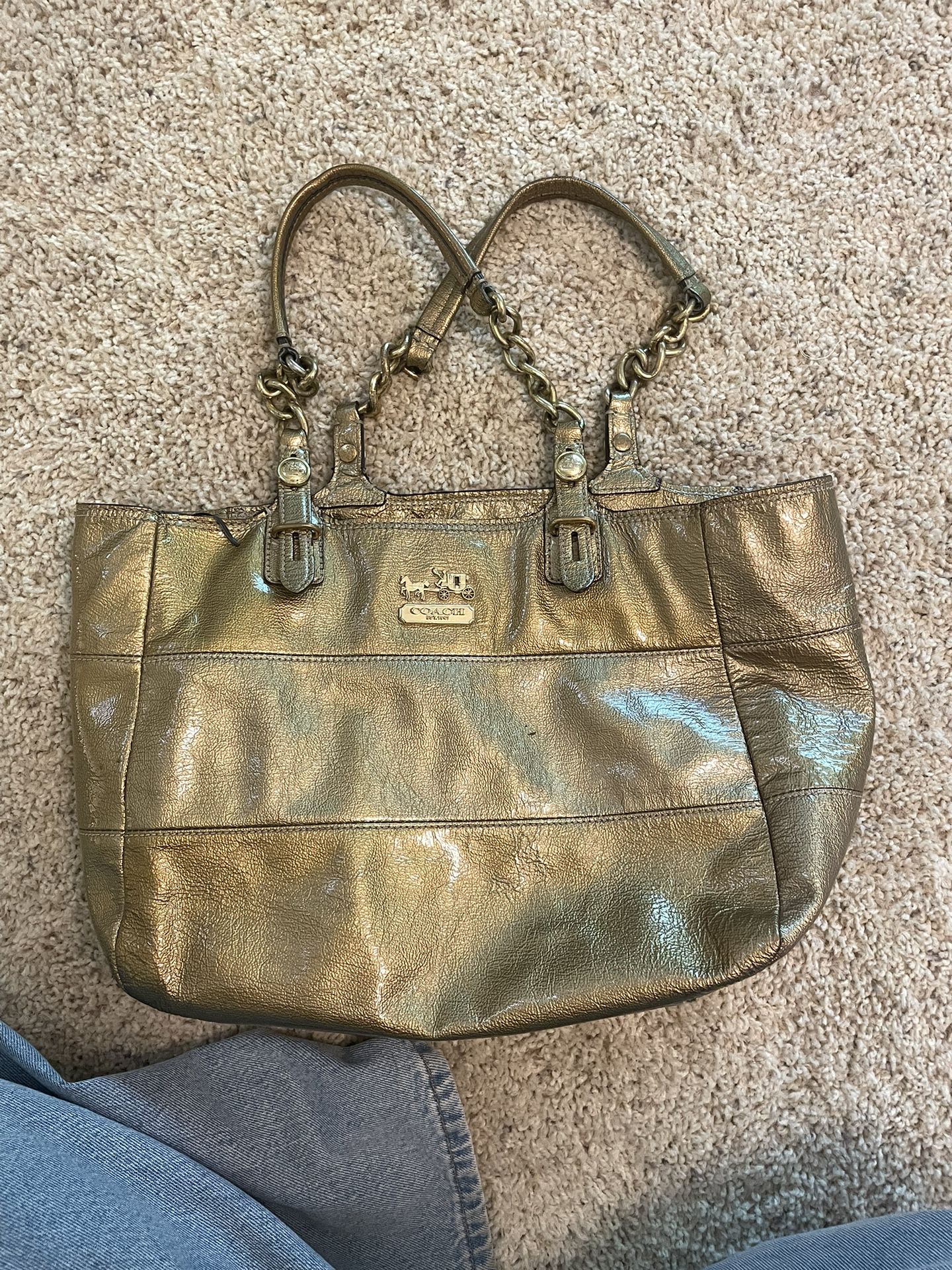 Coach purse, gold color, with blue interior.