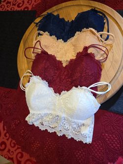 4 Lacy Bra's. Red, white, beige, blue. Size L-XL