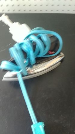 Vintage travel iron with srtitzer bottle