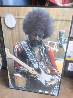 Framed Poster of Jimi Hendrix(Authentic 2005)guitarist playing a white Fender Stratocaster