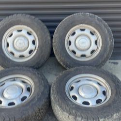 Ford 7 lug steel 17-inch wheels with old tires 