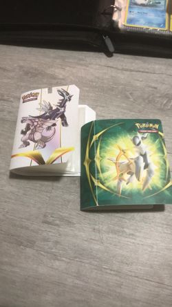 Two mini Pokémon card binders empty