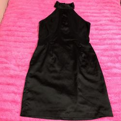 Do & be size medium black silky lace up back mini dress with strips that are semi sheer ARMPIT TO ARMPIT: 32” LENGTH: 34.5”