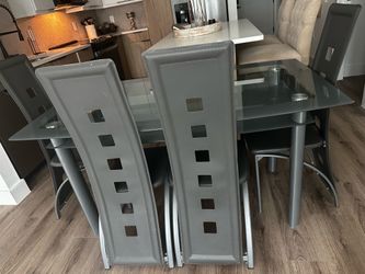 Modern glass dining table with 4 chairs