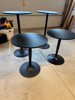 Set of four cocktail tables