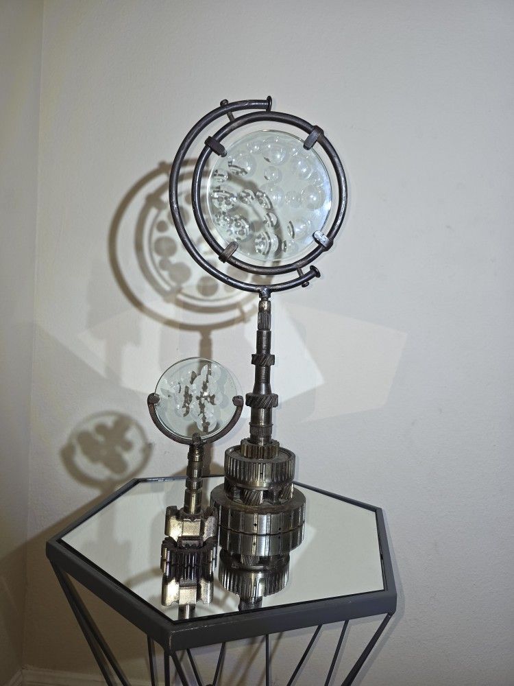 One-of-a-kind mechanical sculpture made from solid metal and glass. Heavy, detailed, and locally crafted by artists with an industrial edge.  
- Uniqu