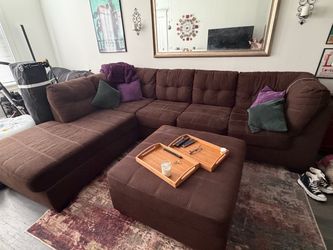 Brown sectional sofa and ottoman