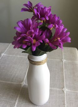 Chalk painted milk bottle with silk flowers included