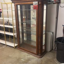 Traditional style illuminated oak curio cabinet