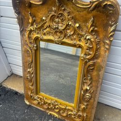 Ornate gold Renaissance mirror.. With engraving from 1966… 43“ x 29” $300