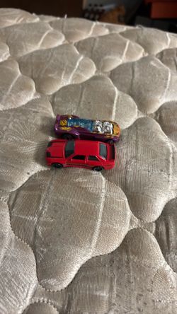 2 hot wheels racing card asking 15 dollars OBO