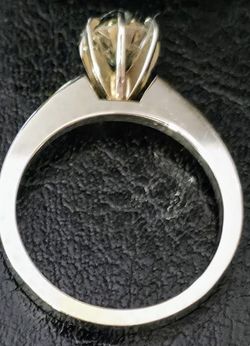 1 CT, AND A WHITE GOLD SETTING, SILVER LIKE SETTING AS WELL
