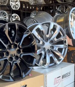 GMC sierra wheels and tires 22” with 33”
