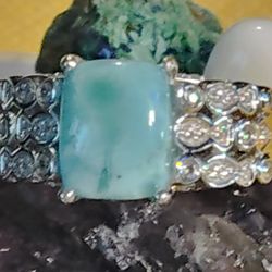 WHAT A NATURAL BEAUTY  LARIMAR, THE SIMPLICITY OF ZIRCON, ENCIRCLED AS THIS IS. ON THE SHOULDERS. 100% - 925 SILVER. SIZE 7