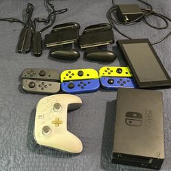  Nintendo Switch W/ Case,3 Pairs Of Joy Cons, Dock And Charger (HDMI cord not included), 1 Pro Controller, 2 Pairs Of Joy Con Straps And 2 Grips