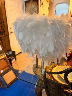 White pearly looking feather lamp