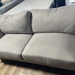 Comfortable gray sofa in good condition.