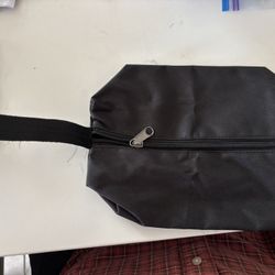 Durable black fabric bag with a sturdy handle.