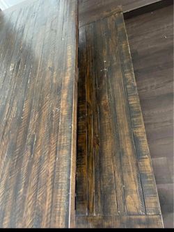 Dining table with two benches and sideboard