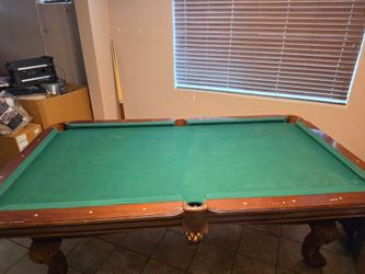 8 ft pool table with pool balls and sticks. Free