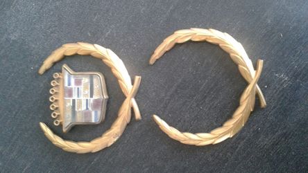 Cadillac emblem gold plate