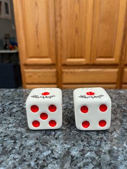 Vintage Souvenir Las Vegas Dice Pair of Salt And Pepper Shakers.  Preowned.  Size approximately 2 inches tall.  Has been on display in a cabinet with 