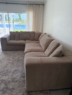 Large Beige L-Shaped Sectional Sofa. Cruz Sectional from City Furniture