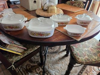 CorningWare "Spice of Life" (Le Sauge, La Marjolaine, and L'Echalote) pyroceram casserole and baking dishes with matching Pyrex glass lids.