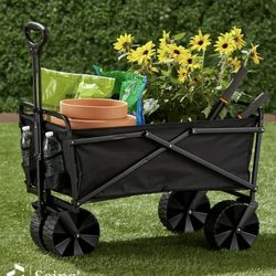 black collapsible folding utility wagon, ideal for hauling gear to the beach, camping, or gardening.