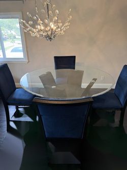 Round Glass Dining Table + 4 Navy Upholstered Chairs
