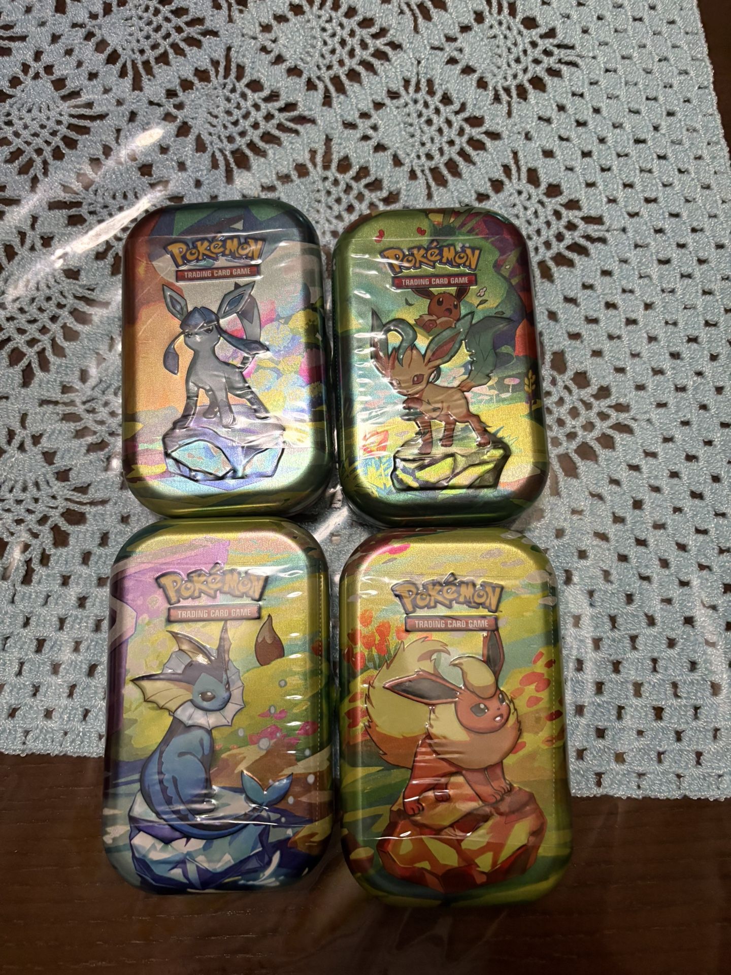 Prismatic Evolutions Pokemon Tins