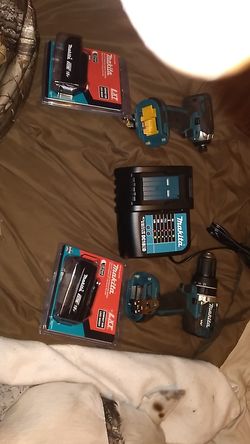 New Makita drill ,impact, 2 batteries and charger with bag.