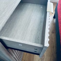 Gray Wood Dresser with Open Drawer