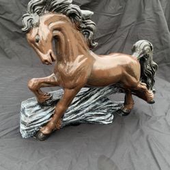 Horse jumping over a log Statue 