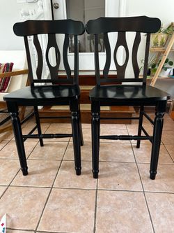 Pair of black wooden counter height chairs