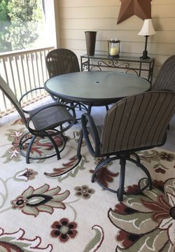 Patio furniture - chairs rock and swivel.