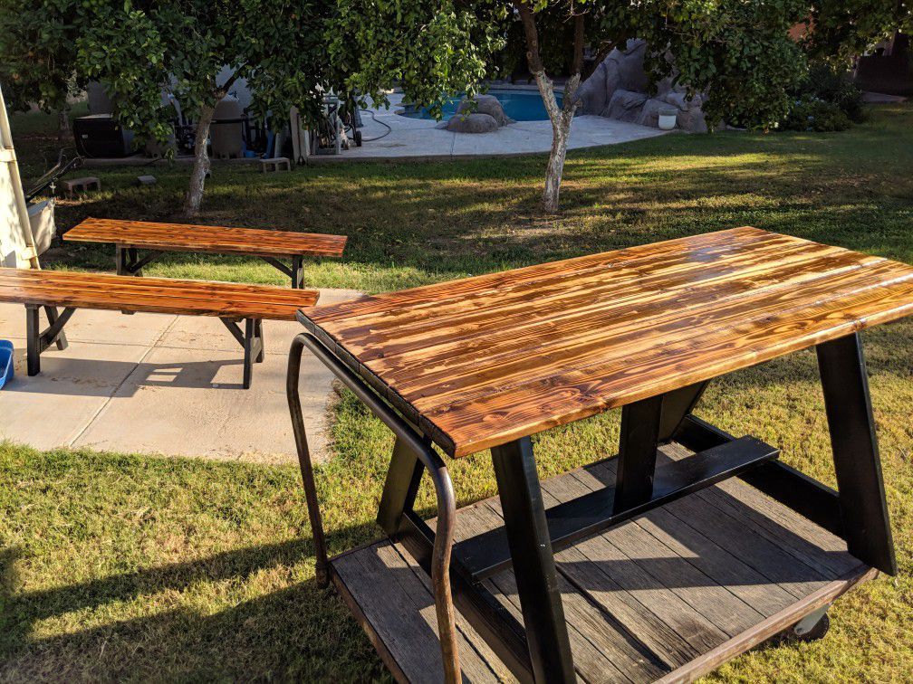 .Indoor, outdoor ,kitchen table with two benches custom stain job ,black legs
