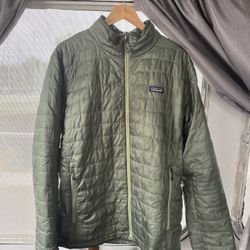 Patagonia men’s XL green  nano puffer jacket.  Some minor stains on arms 