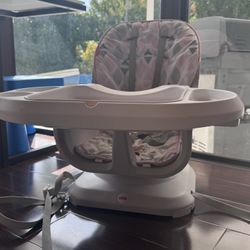 Pink Fisher-Price SpaceSaver Chair Top High Chair - adjustable. Removable tray for dishwasher