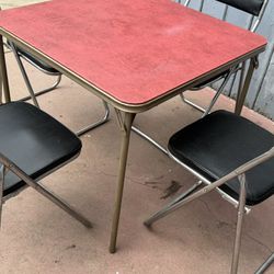 Metal Table And Four Regular Chairs In Good Condition 
