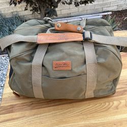 Vintage medium size, olive green canvas, and leather duffel bag