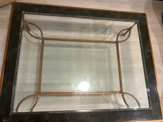 Glass top coffee table with black marble frame and bronze legx