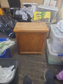 Wooden laundry hamper.