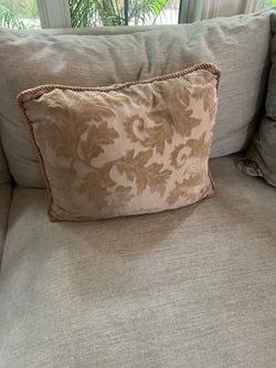 Decorative throw pillow.  Beige